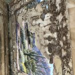 A large framed painting half-eaten by termites